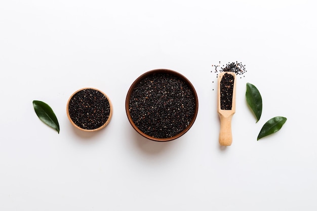 quinoa seeds in bowl and spoon on colored background Healthy kinwa in small bowl Healthy superfood