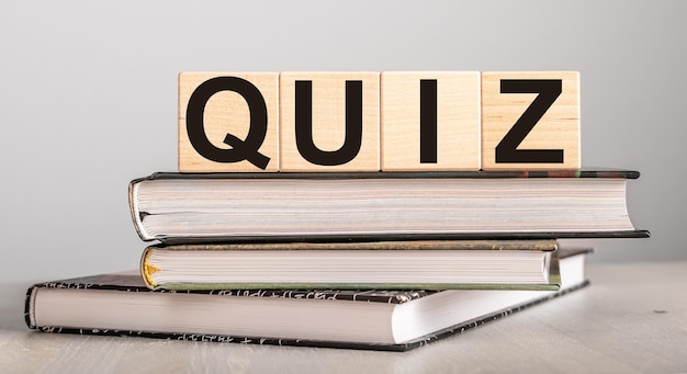 Quiz word on wood blocks and books for education Quizz test for knowledge