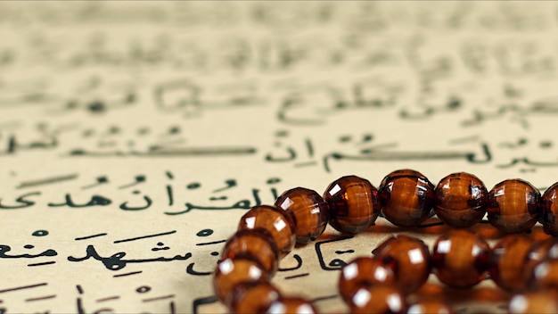 Quran the holy book of muslim religion and Pray Counting Bead Photo