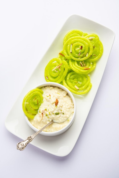 Rabdi Jalebi Green jilebi or imarati with Rabri made from condensing milk Indian dessert