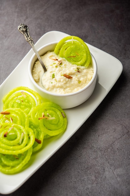 Rabdi Jalebi Green jilebi or imarati with Rabri made from condensing milk Indian dessert