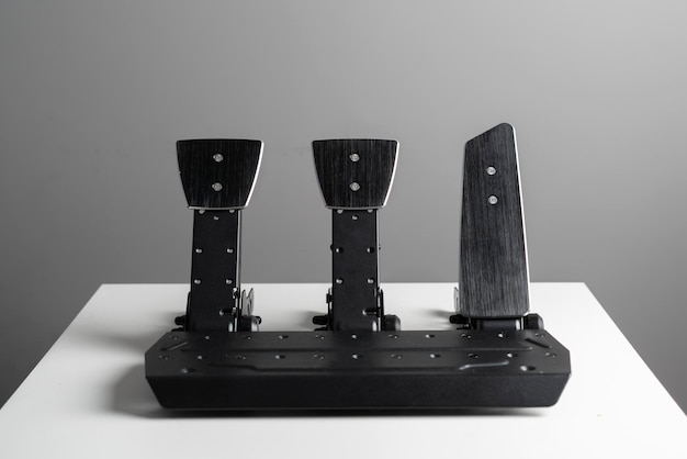 A race car black pedals three pedals for autosport use clutch throttle and brake