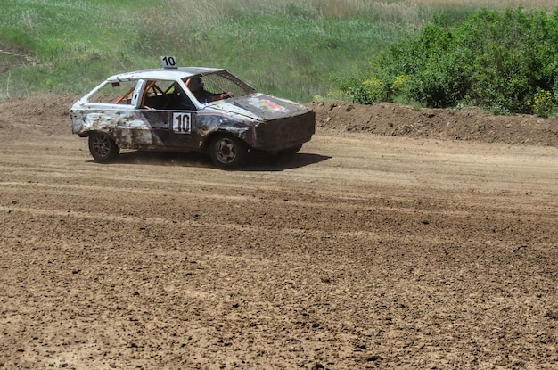 Race of the old wrecked cars Rally on the open air with dust