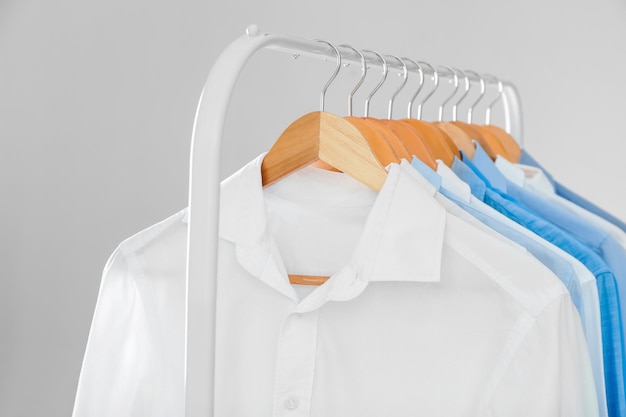 Rack with clean shirts in laundry