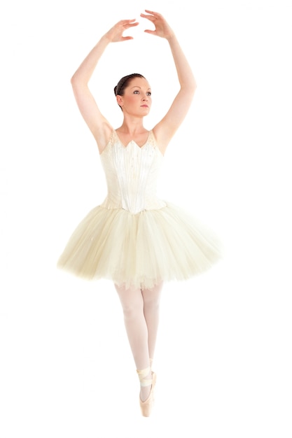 Radiant ballet dancer training over white background