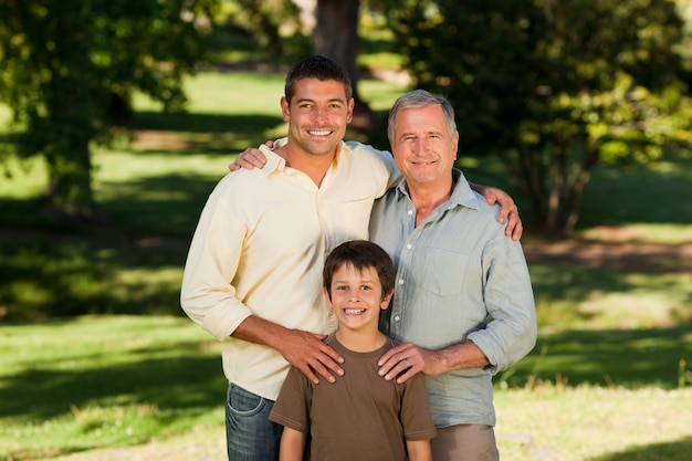 Radiant family looking at the camera in the park