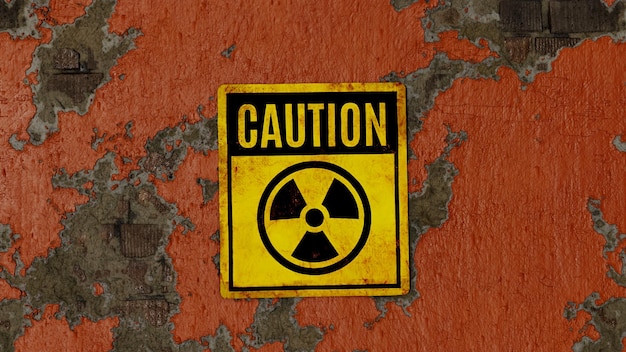 Radioactivity sign caution on an orange painted peeling brick wall