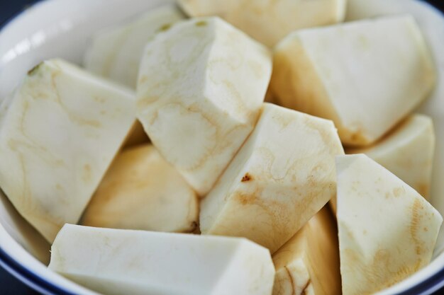 Radish in a bowl peeled and cut into large pieces