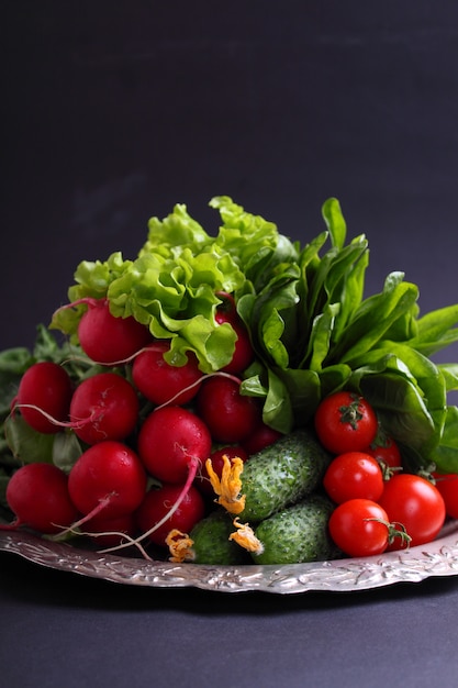 Radish cucumber cherry in a metal tray