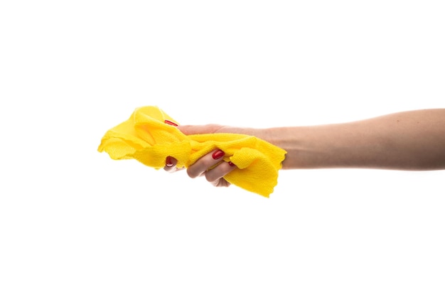 Rag microfiber in female hand with red nails isolated on a white background