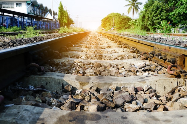 Railroad against beautiful sky at sunset Industrial landscape with railway station