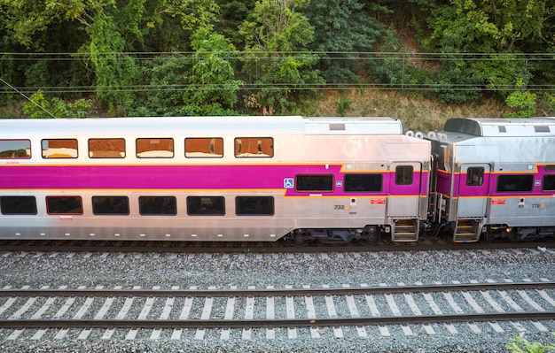 Railroad tracks and a train represent journey connection progress and the passage of time in a si