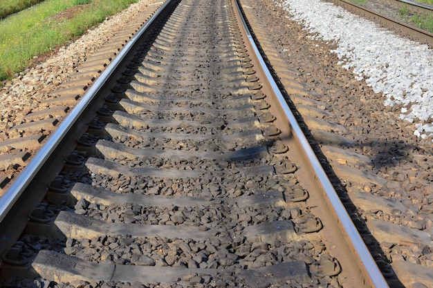 railway isolated going forward in sunny day, close-up