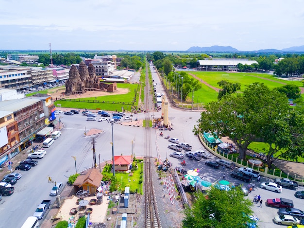 Railway near historic sites with a parked car waiting for the train run pass over