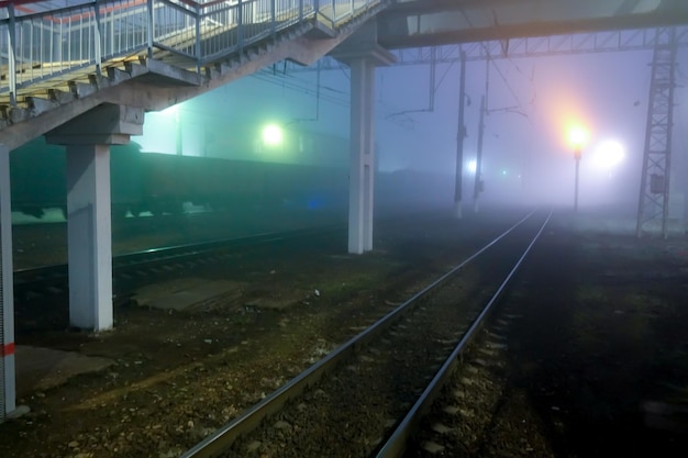 Railway station in Russia. Night, fog, early morning