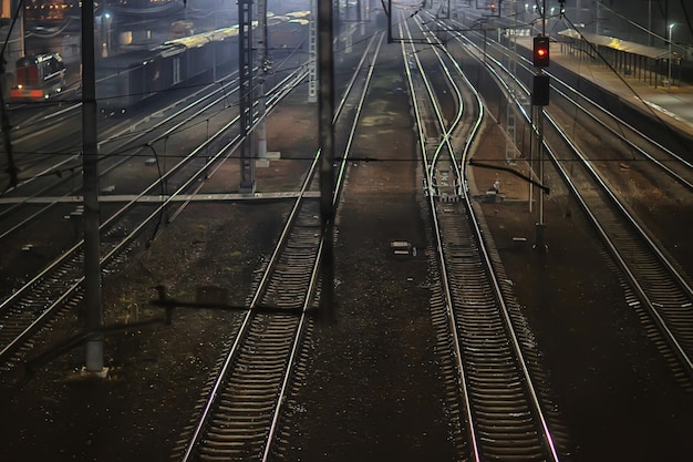 railway tracks night landscape at the railway station fog autumn