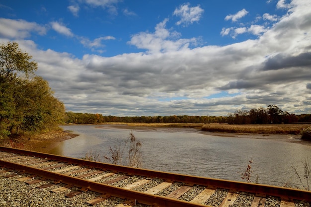 Railway tracks with blue sky and cloud in the evening