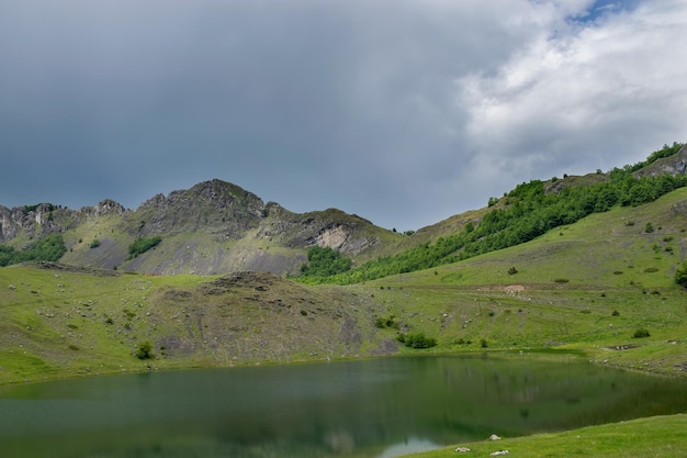 Rain clouds are approaching the mountain lake