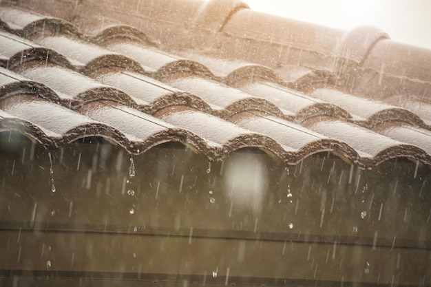 Rain falling down from the house roof