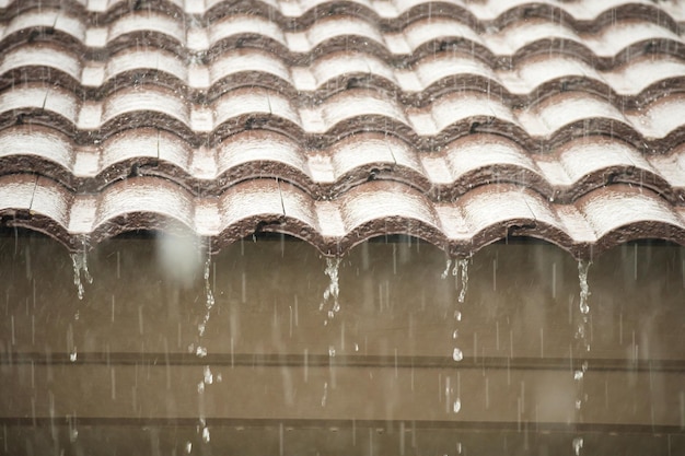 Rain falling down from the house roof