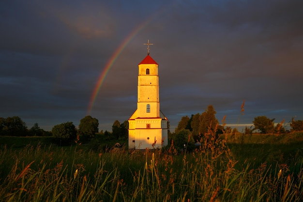 Rainbow over ancient church