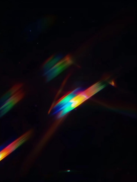 rainbow colored light reflecting off a dark background