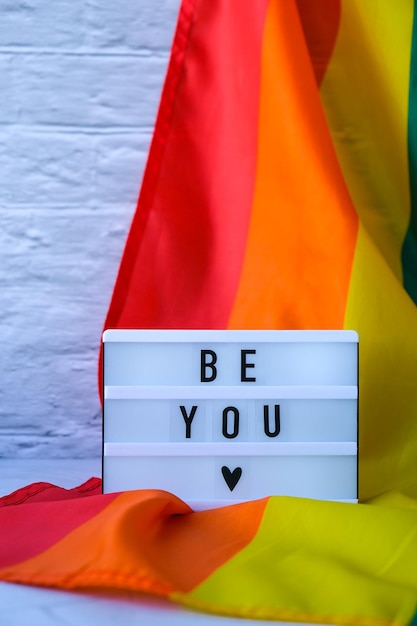 Rainbow flag with lightbox and text be you rainbow lgbtq flag made from silk material symbol of lgbt