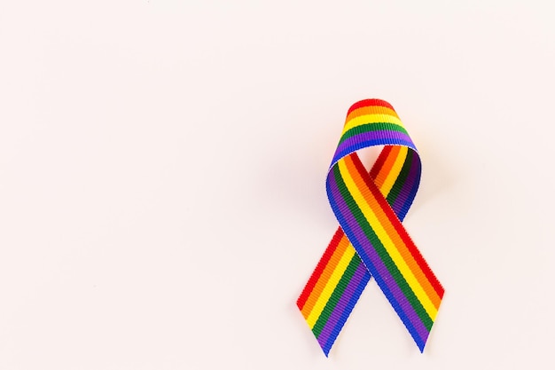 Rainbow Gay Pride ribbon on a white background.