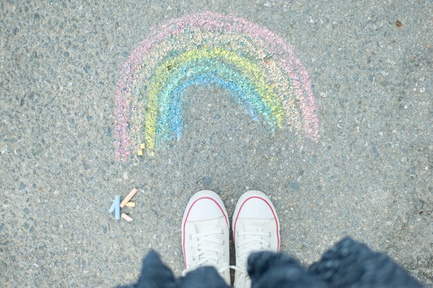 Rainbow paint with colored chalks on pavimen