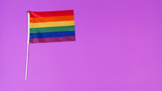 Rainbow pride flag on purple background