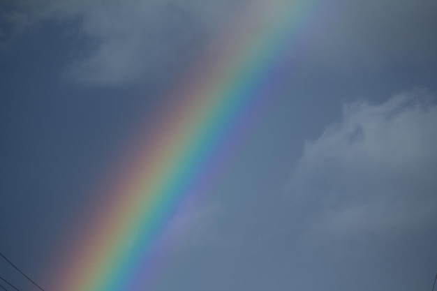 Rainbow in the skyPicturesque view of beautiful rainbow and blue sky on sunny day