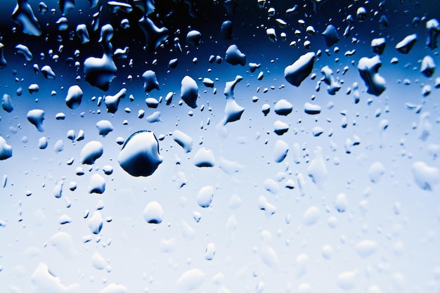 Raindrops on blue glass