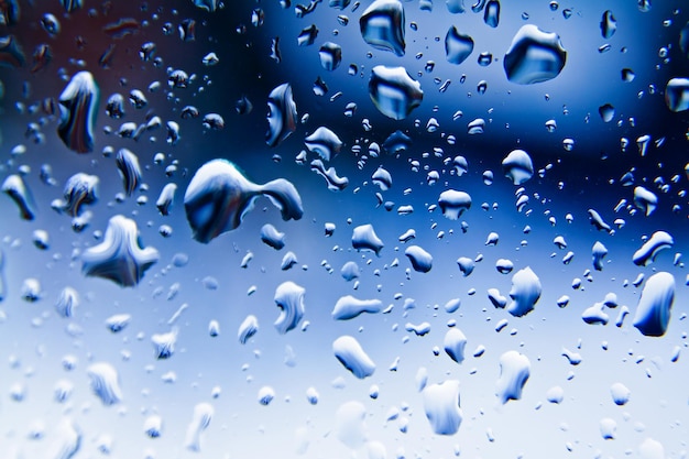 Raindrops on blue glass