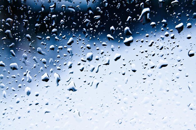 Raindrops on blue glass