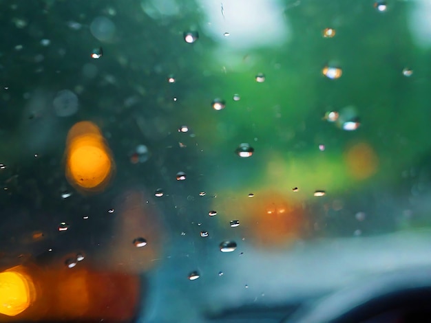 raindrops seen through the glass of a care image download