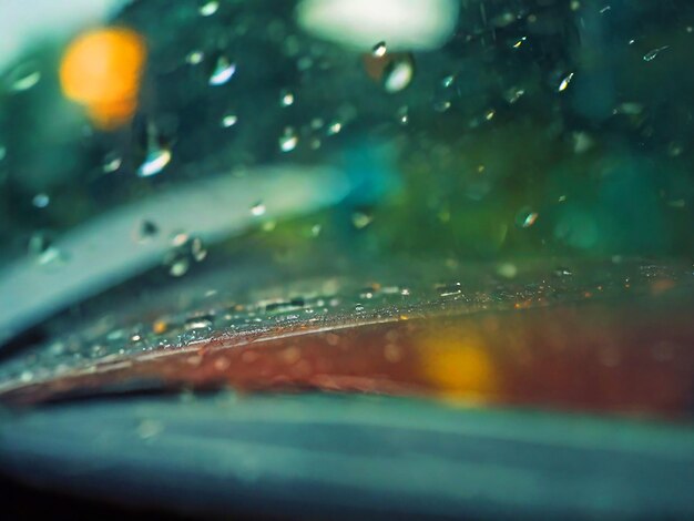 raindrops seen through the glass of a care image download