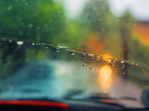 raindrops seen through the glass of a care image download