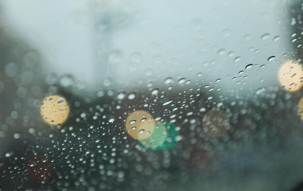 Raindrops on windowpane during a rainy day capturing the tranquility and melancholy of nature's tea