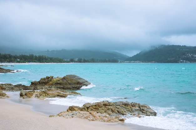 Raining in the sea and coming in the beach.