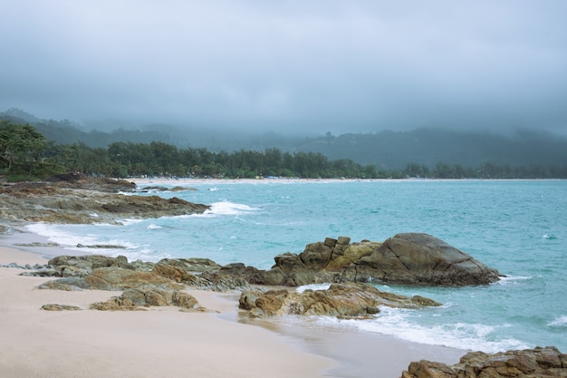 Raining in the sea and coming in the beach.