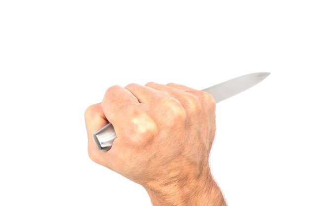 Raised hand with a knife on a white background