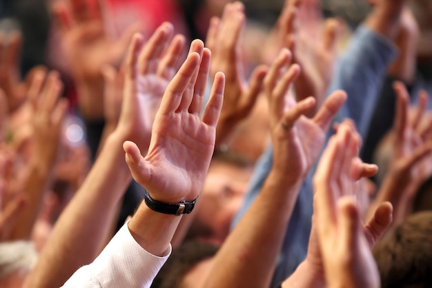 Raised up a human hands at the event