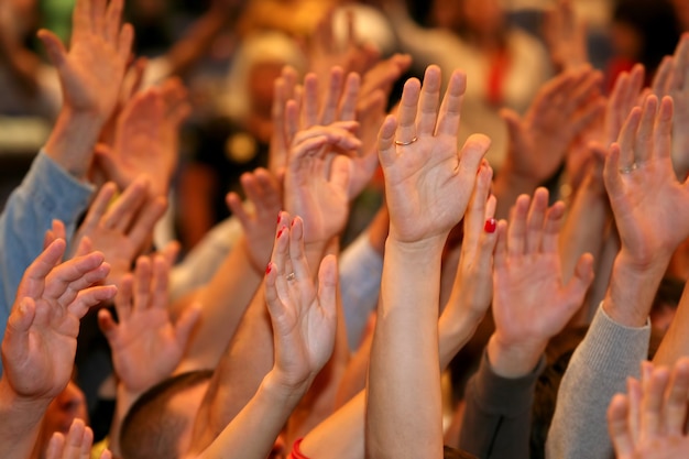 Raised up a human hands at the event