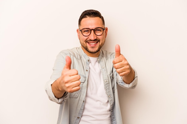 Raising both thumbs up smiling and confident