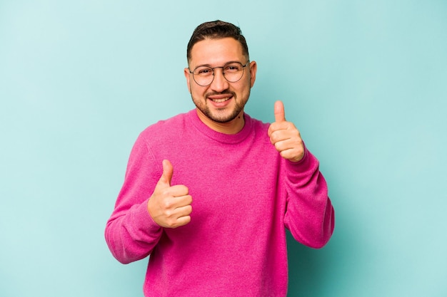 Raising both thumbs up smiling and confident