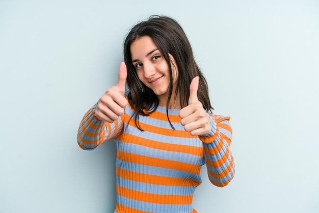 Raising both thumbs up smiling and confident