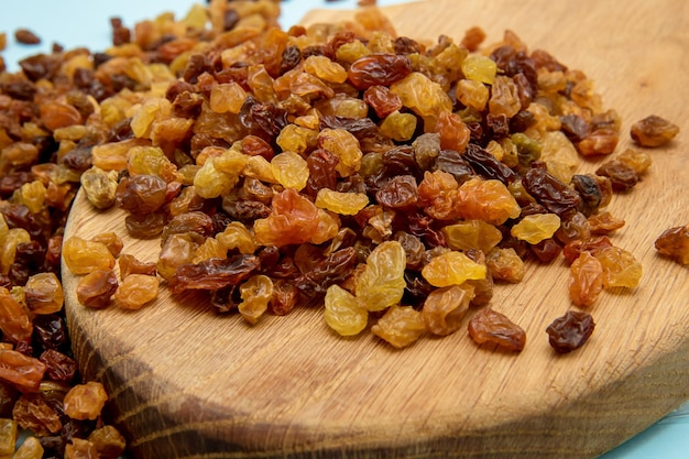 Raisins closeup on a wooden board