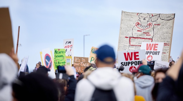 Rally people and protest with sign for vaccine corruption solidarity and human rights in medical research Law change and crowd activism in street with poster fight and freedom of choice in group