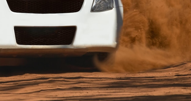 Rally race car drifting on dirt track