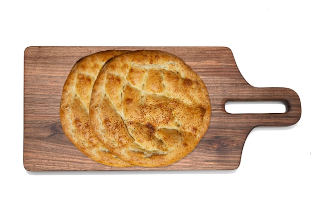 Ramadan pita on wooden board Traditional Ramadan bread